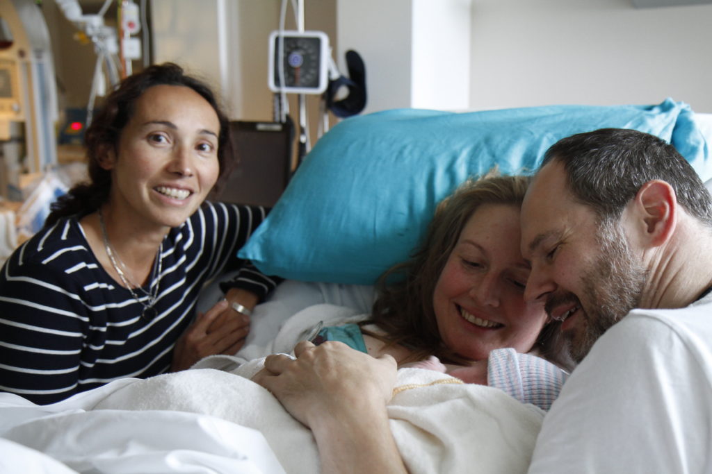 family-with-newborn-baby-with-doula